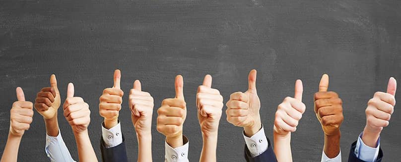 Company policy - TEGA 11-hands-with-thumbs-up-in-front-of-a-gray-solid-colored-background
